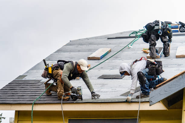 Professional Storm Damage Roof Repair technician working in Farmington, NY